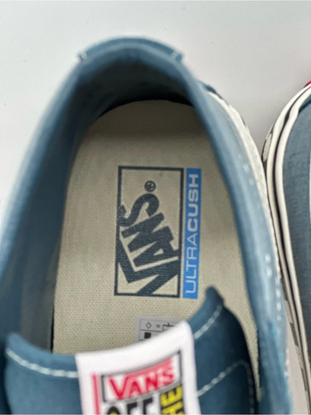Vans Mid-Top Sneakers in Teal and White with Checkerboard Sole